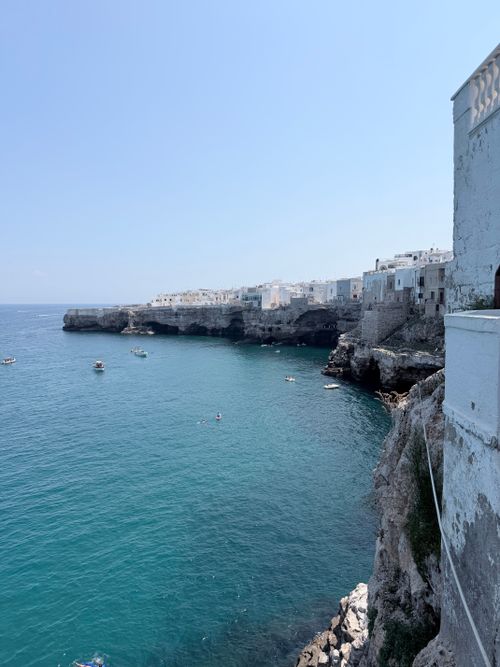 Free Stunning coastal view of Polignano a Mare, Italy with cliffs and bright blue sea. Stock Photo