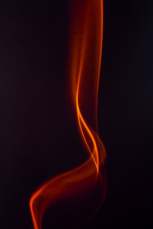 Free Artistic photo of swirling red smoke on a dark background. Stock Photo