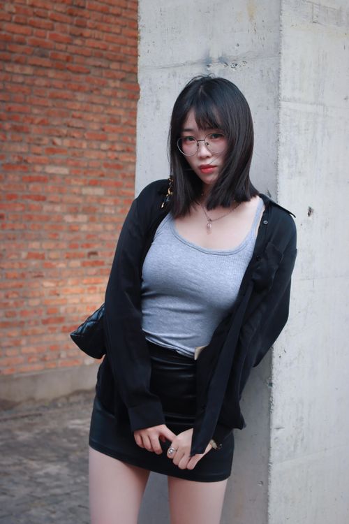Free Young woman in casual attire poses outside in Nanjing, China. Stock Photo