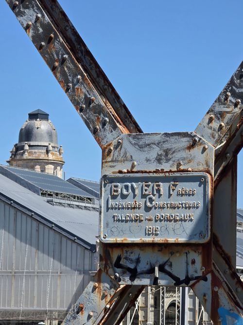 Free Close-up of a historic rusty steel framework with blue sky in La Rochelle, France. Stock Photo