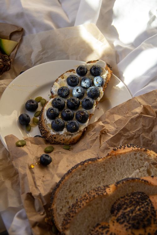 Free Toasted bread topped with blueberries and seeds for a nutritious breakfast. Stock Photo