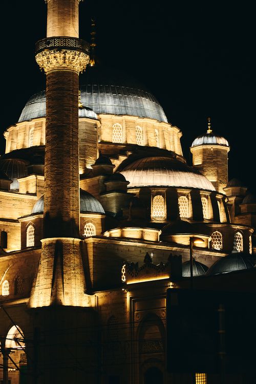 Free Stunning night view of an illuminated Ottoman mosque showcasing intricate architecture in Istanbul. Stock Photo