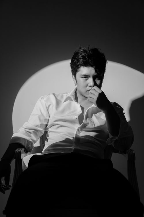 Free Artistic black and white portrait of a man in dramatic lighting. Stock Photo