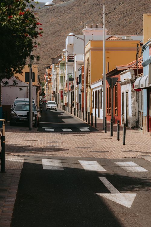 Free Colorful buildings lining a sunny street in San Sebastián de La Gomera, Canary Islands. Stock Photo