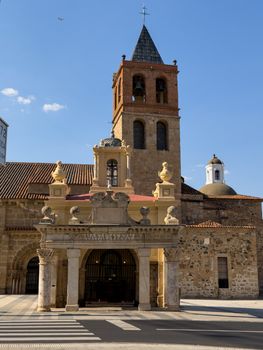 Ancient church architecture in Mérida, Spain with clear blue skies.