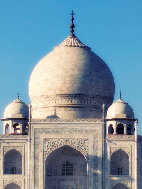 Free Close-up view of the Taj Mahal's iconic dome with a clear blue sky in Agra, India. Stock Photo