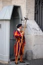 Traditional warrior with spear on street