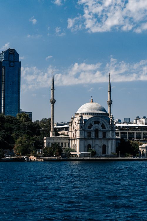 Free Beautiful view of Ortaköy Mosque by the Bosphorus in Istanbul with clear blue sky. Stock Photo