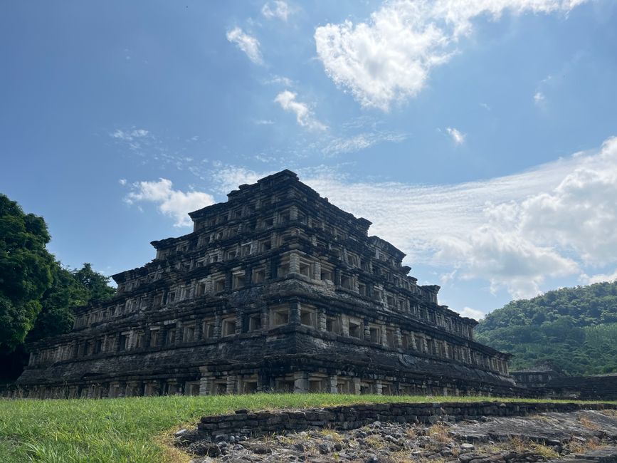 Ancient pyramid at El Tajín under a bright summer sky in Poza Rica, Mexico.