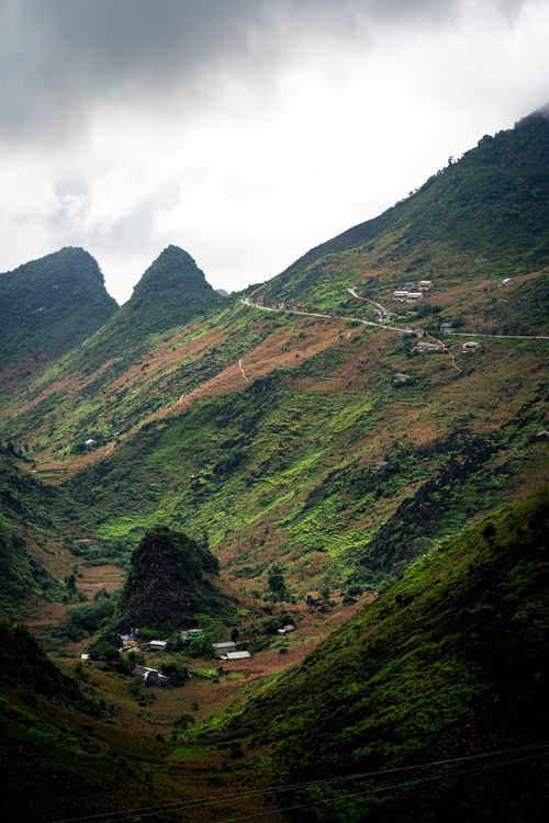 Free Breathtaking view of lush green mountains and hills in Meo Vac, Hà Giang, Vietnam under cloudy sky. Stock Photo