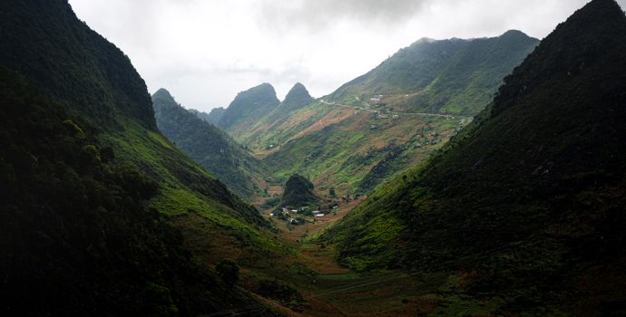 Panoramic view of lush green mountains and valleys in Meo Vac, Hà Giang, Vietnam.