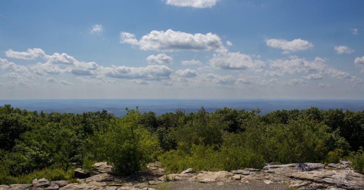 Gorgeous summer view from Mount Wachusett, featuring lush green landscapes and a clear blue sky.