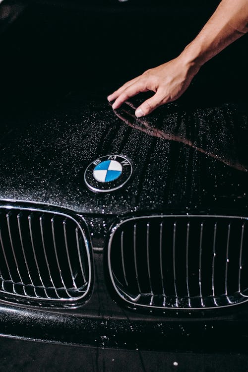 Free Photo Of Person Touching Car Stock Photo