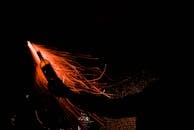 Person Holding Molotov Cocktail