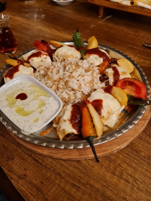 Free Appetizing Turkish kebab served with rice and sides, perfect for a culinary adventure. Stock Photo