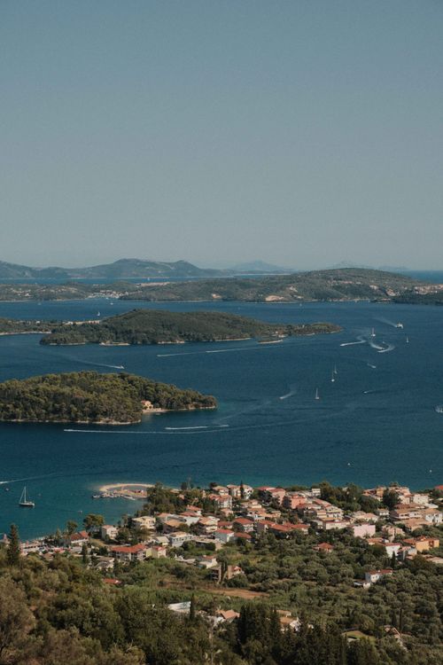 Free Beautiful aerial view of Lefkada's coastline and islands under a clear summer sky. Stock Photo