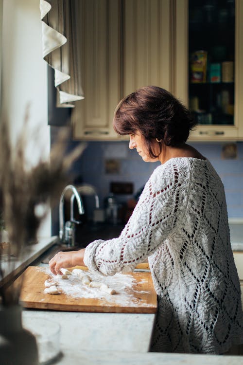 Woman Cutting Dough