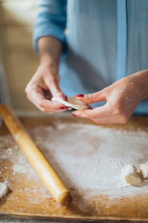 Person Holding Dough