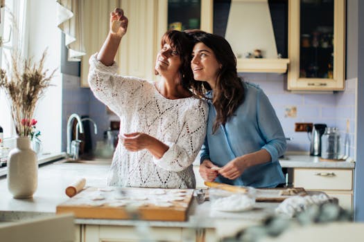 A mother and daughter enjoying time together preparing traditional pelmeni in a cozy kitchen.