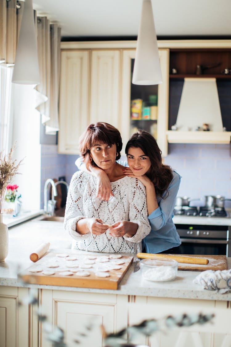 Mother And Daughter In Kitchen