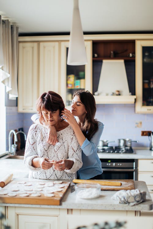Free Woman Fixing Her Mother's Hair Stock Photo