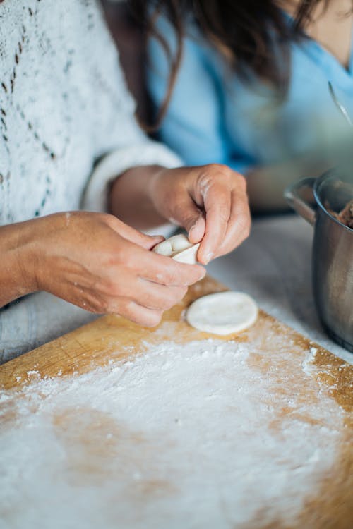 Person Holding Dough