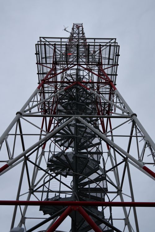 Free Tower against a cloudy sky in Gdańsk, showcasing industrial architecture. Stock Photo