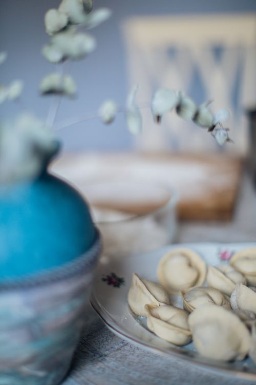 Free A close-up of traditional Russian dumplings on a rustic table setting, perfect for authentic food themes. Stock Photo
