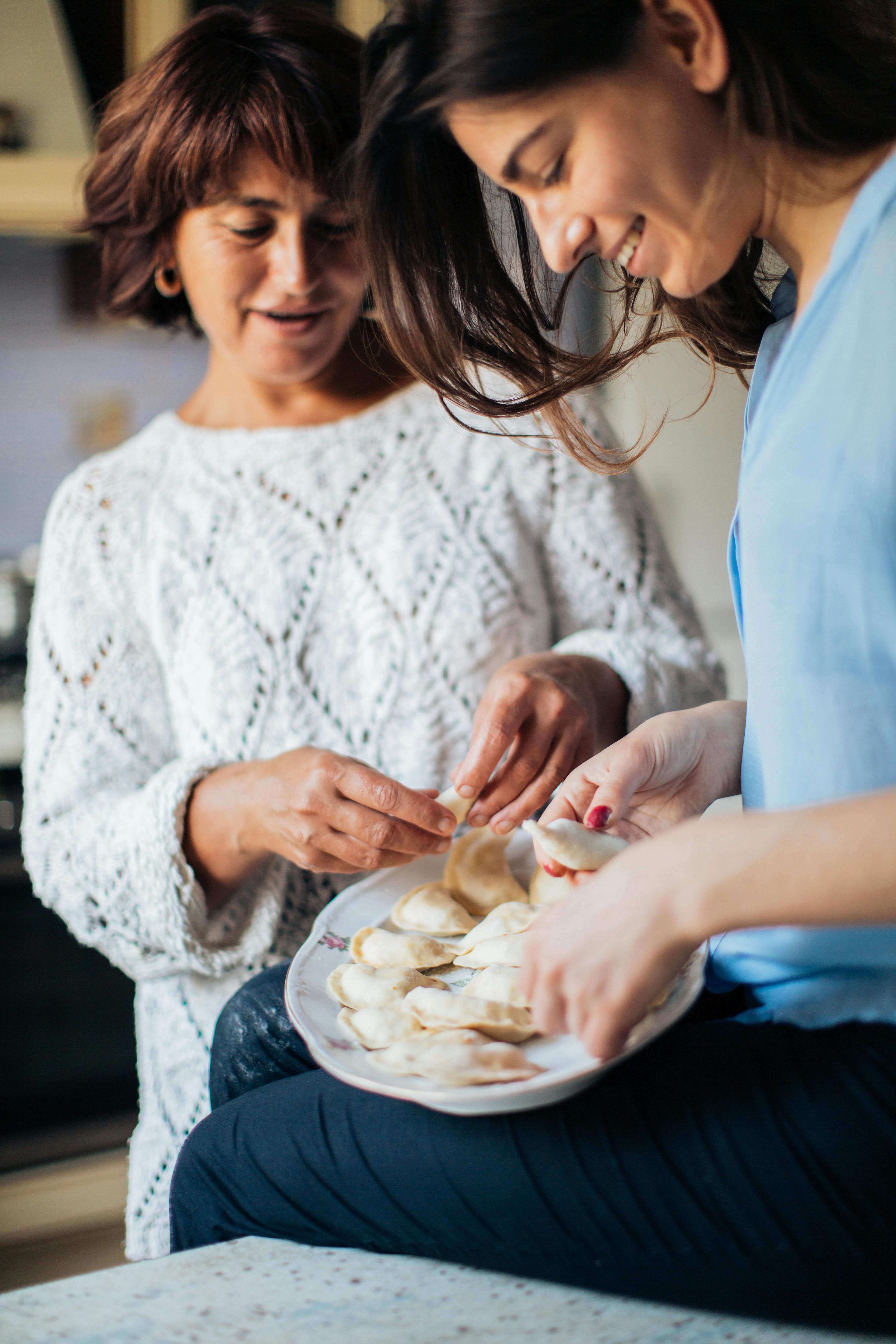 Women In Holding Dumplings