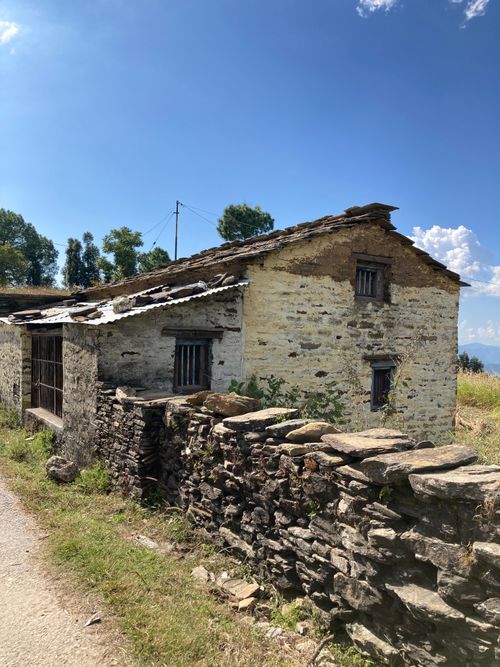 Free Quaint stone house with slate roof in sunny Almora, India, showcasing rural architecture. Stock Photo