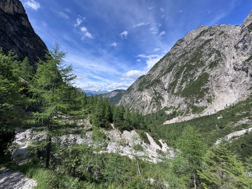 Free Beautiful view of lush green Alps against a bright blue sky in Tyrol, Austria. Stock Photo