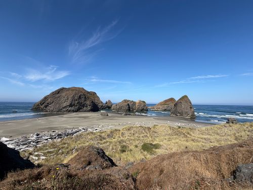 Free Beautiful view of Bandon Beach with distinct rock formations under a clear blue sky. Stock Photo