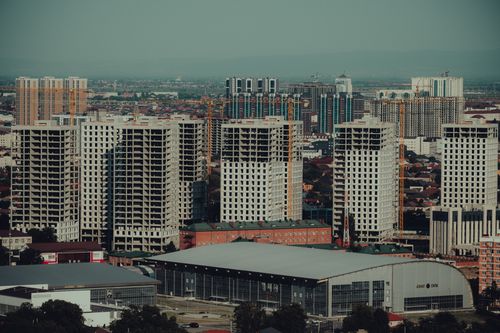 Free Aerial view of construction and urban development in Grozny, showcasing modern skyscrapers and cityscape. Stock Photo