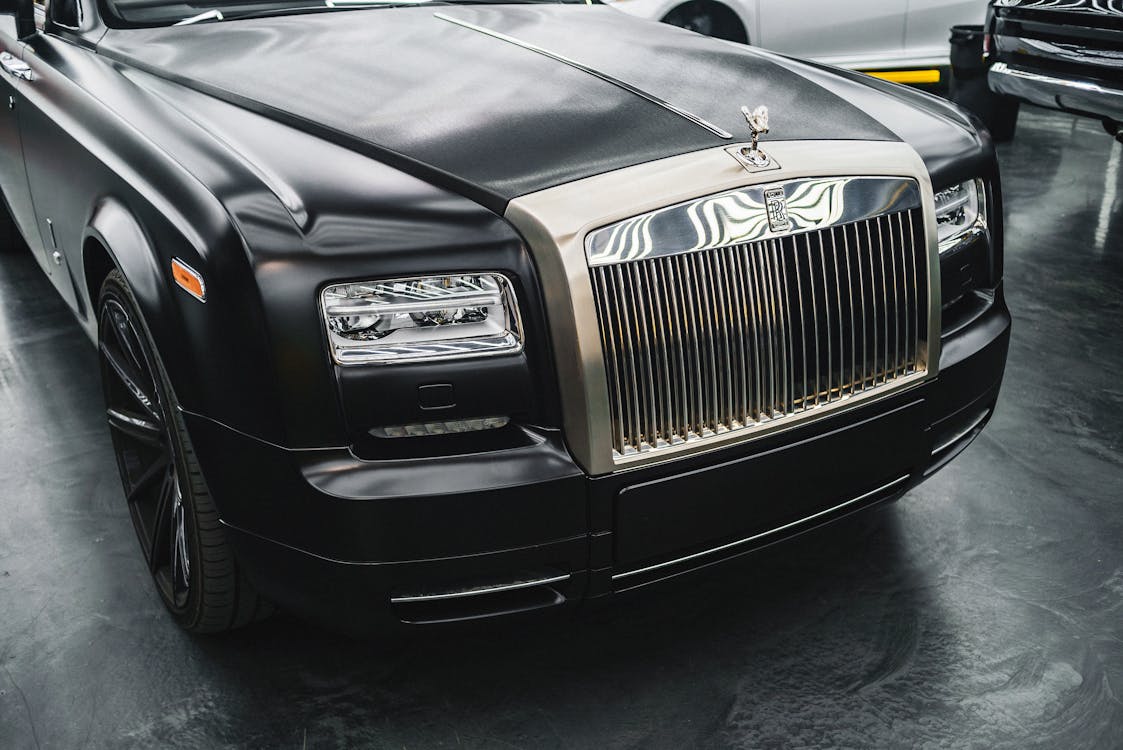 A black Rolls Royce Dawn.