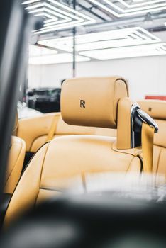 Close-up of a luxurious leather seat in a convertible, showcasing elegance and style.