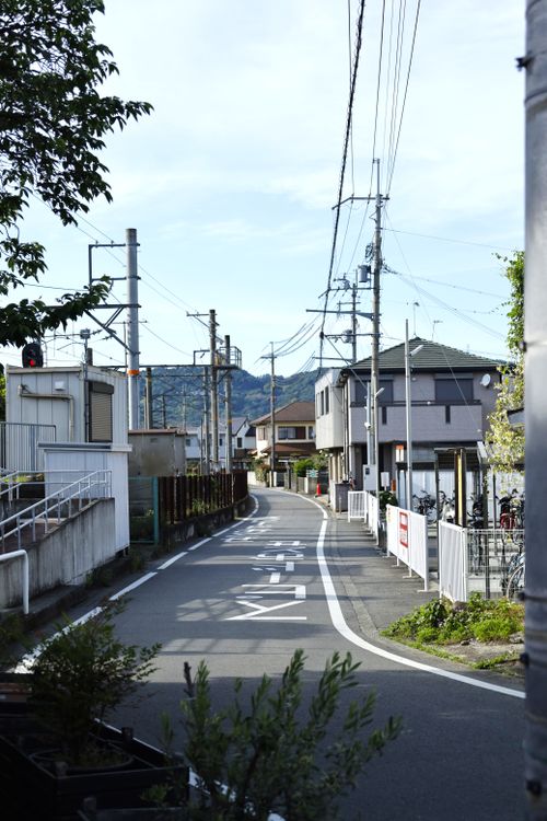 Free A quiet residential street in Kinokawa, Wakayama, Japan with power lines and houses. Stock Photo