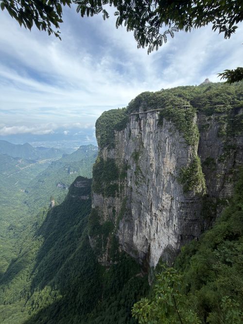 Free Dramatic cliff view in Enshi Grand Canyon, Hubei, China with lush greenery under a bright sky. Stock Photo