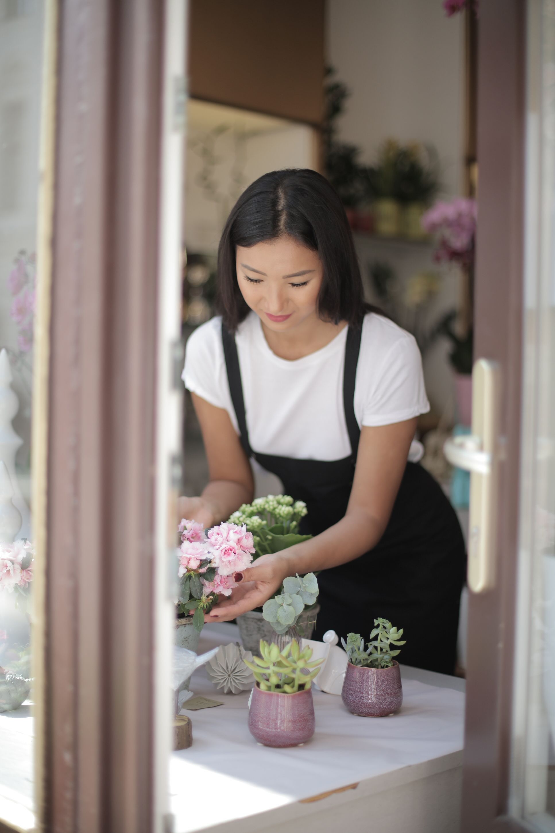 Woman in Black and White Dress Holding Bouquet of Flowers · Free Stock ...