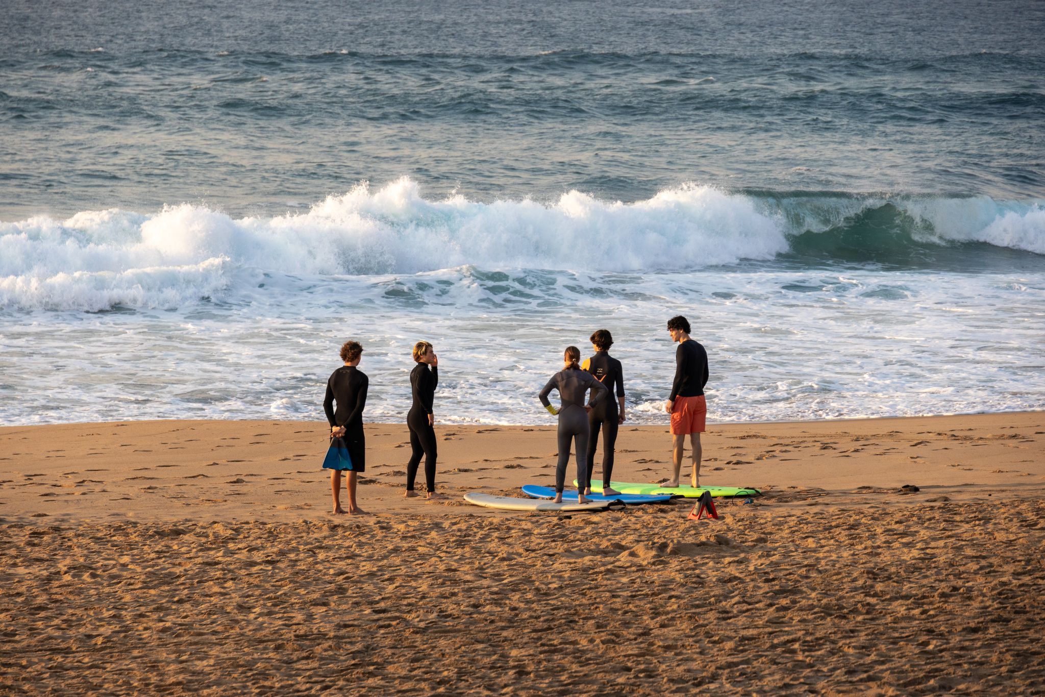Kids with surfboards on the beach
