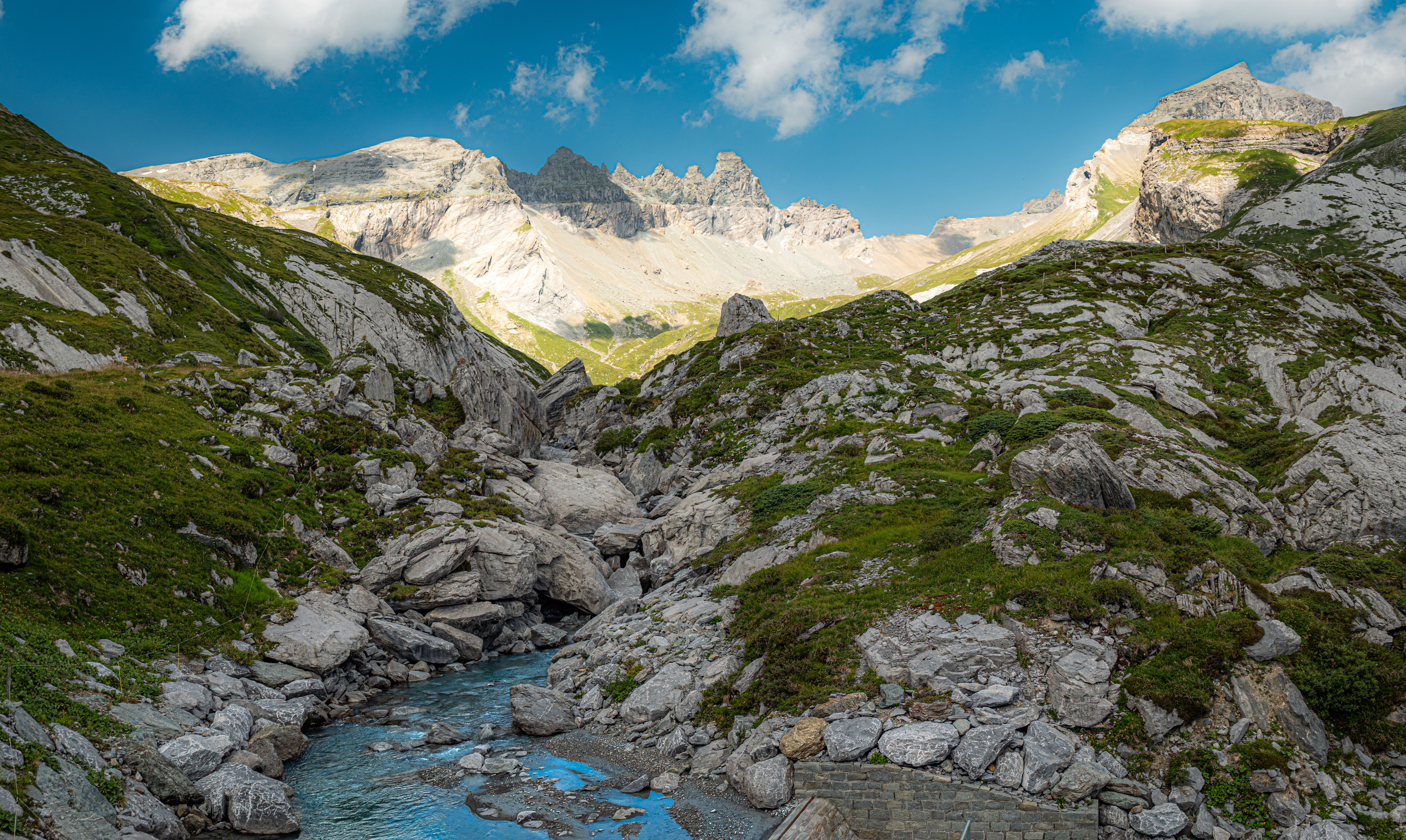 Stunning view of the Swiss Alps in Flims, with clear skies and rocky terrain.