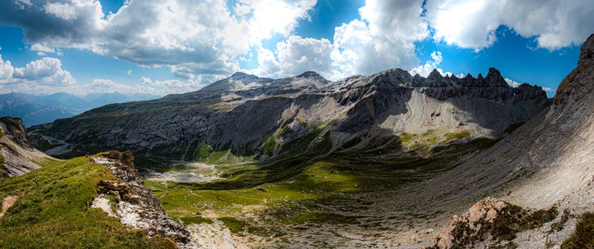 Breathtaking panoramic view of the Swiss Alps in Flims, Graubünden, captured on a sunny summer day.