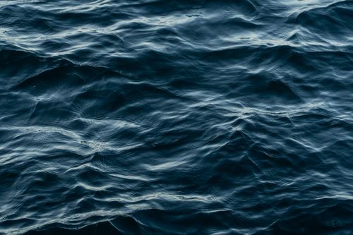 Free Peaceful view of gentle ocean waves creating a soothing texture on the water surface. Stock Photo