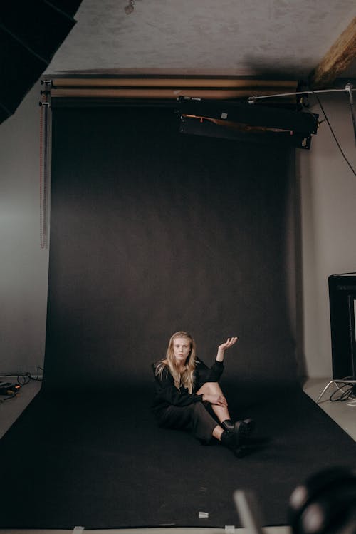 Free Woman In Black Clothing In A Studio Stock Photo