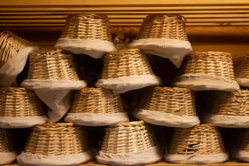 Free Close-up of stacked wicker baskets with fabric linings indoors in Belgium. Stock Photo