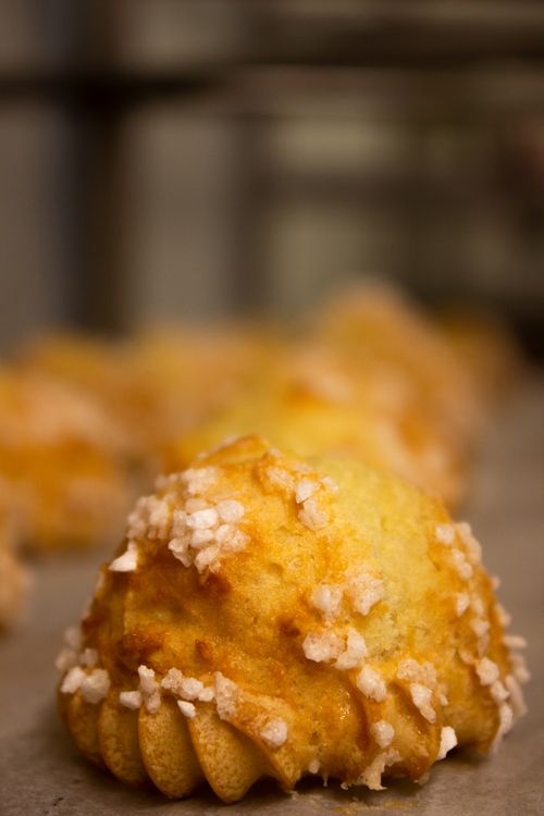 Free Delicious golden brown pastry topped with sugar crystals on a baking tray. Stock Photo