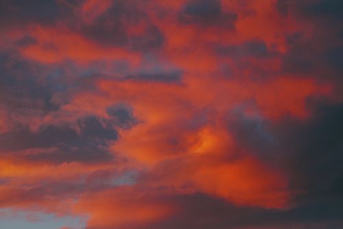 Free Dramatic sky with vibrant orange and purple clouds during sunset. Stock Photo