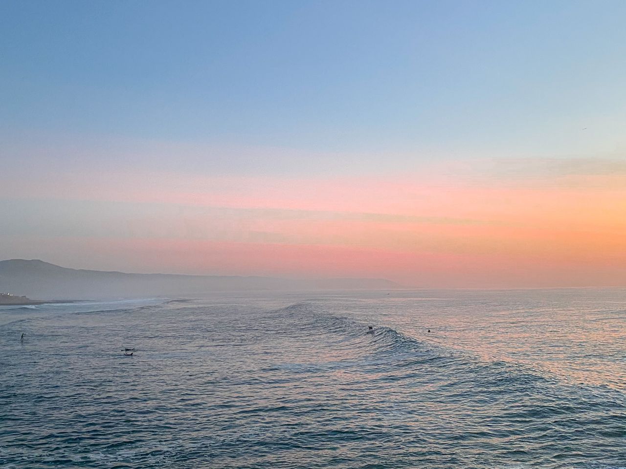 a tranquil scene of ocean waves during a vibrant sunset creating a ser