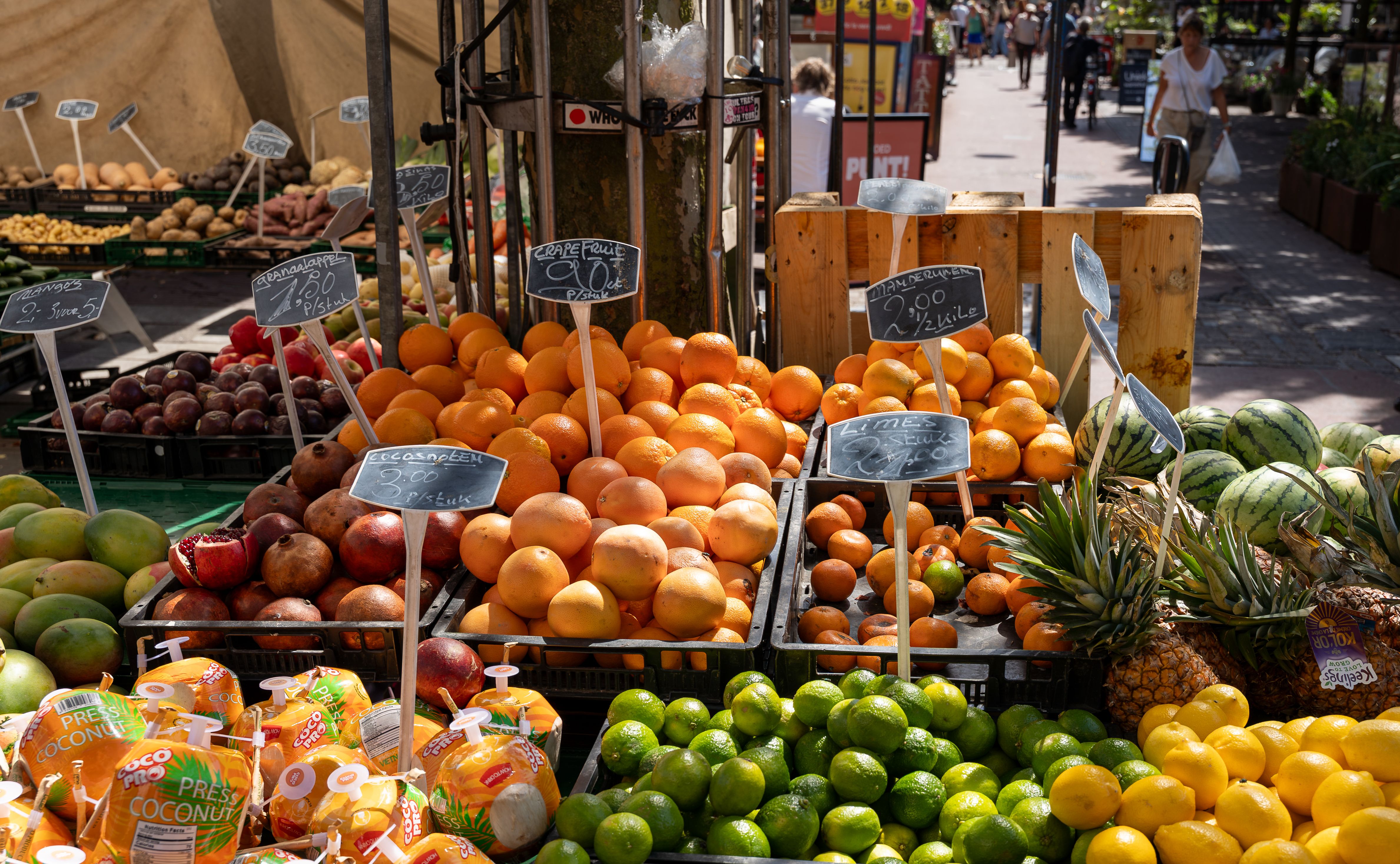 A bustling scene inside Marché des Enfants Rouges, Paris's oldest covered market, with various food stalls