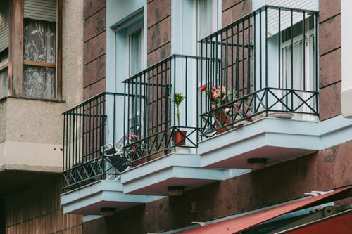 Free Charming European balconies adorned with potted plants in San Sebastián de La Gomera, Spain. Stock Photo