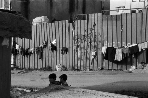 Free Black and white photo of children and clothesline in an Istanbul street. Stock Photo